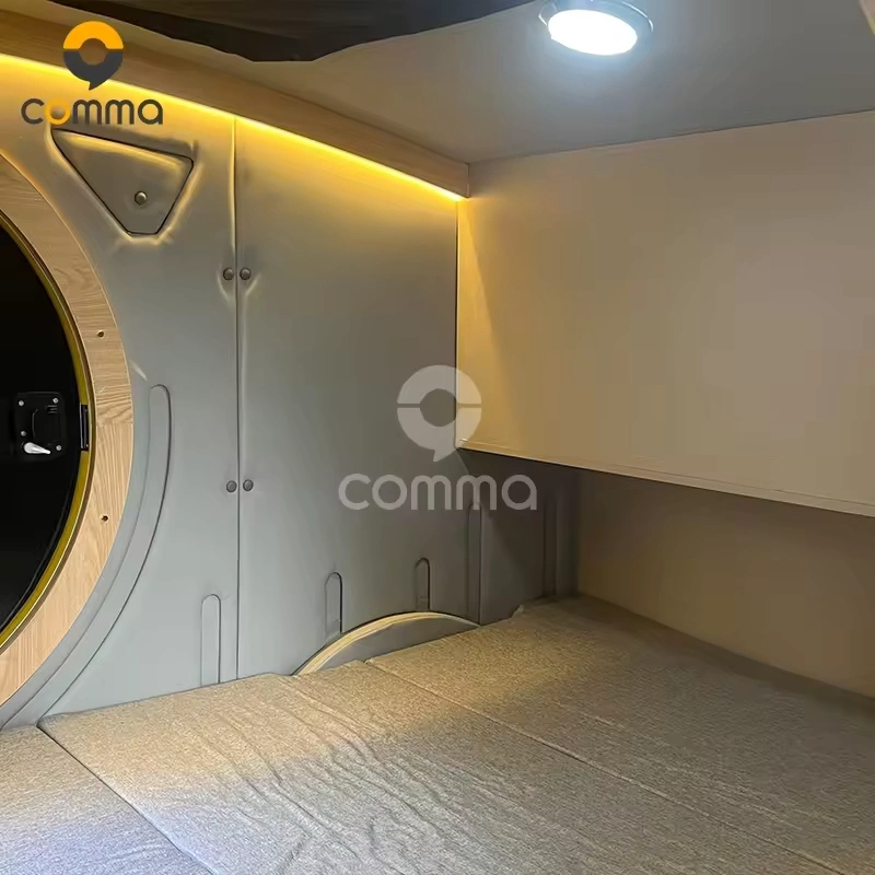 Back to the Future CODE 2604 teardrop caravan interior with queen bed, ambient LED strip lighting and round porthole window