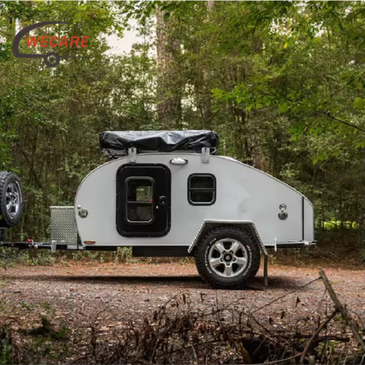 WECARE Basic Teardrop Mini Off-Road Camper Trailer parked in a scenic forest setting for off-grid adventure travel.