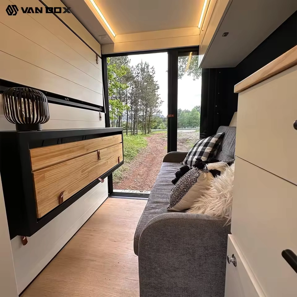 Modular Campervan Interior With Slide Out Kitchen And Scenic Door View