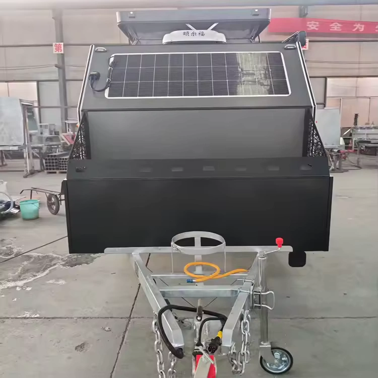 Popup Poppy off-road mini caravan front view with rooftop solar panel, heavy-duty chassis and tow hitch ready for adventure