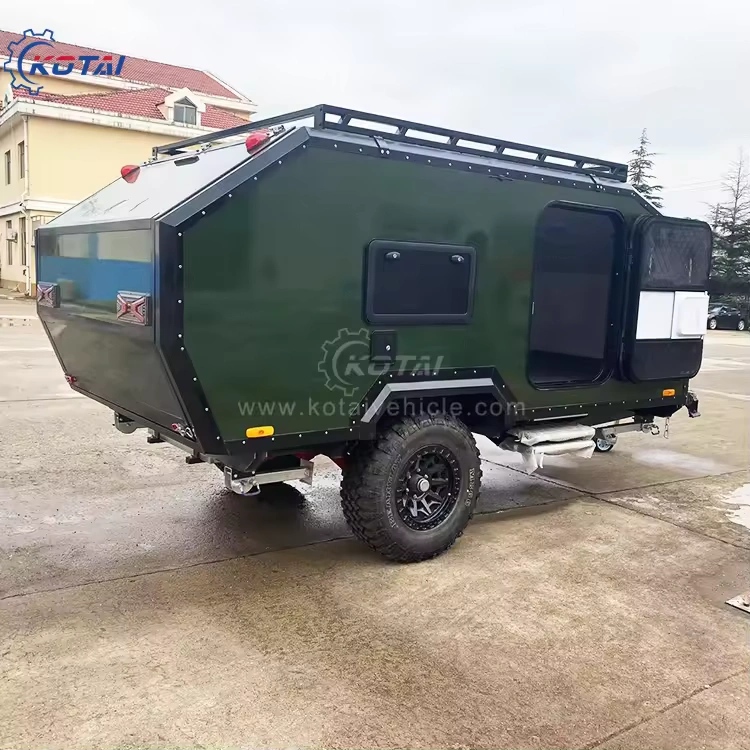 Side profile view of the Rugged Roy off-road teardrop trailer featuring a dark green exterior, rugged tires, and roof rack.