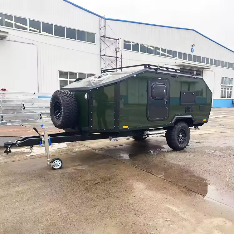 The Rugged Roy off-road teardrop trailer in dark green, featuring a durable galvanized steel chassis and rugged tires.