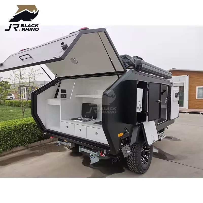 Black Rhino Shark I off-road mini camper trailer featuring an outdoor kitchen, rugged chassis, and compact design.
