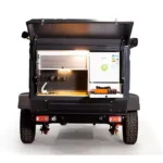 Swiss Army Andy off-road camper trailer rear view showing the integrated outdoor kitchen with fridge and stove setup.