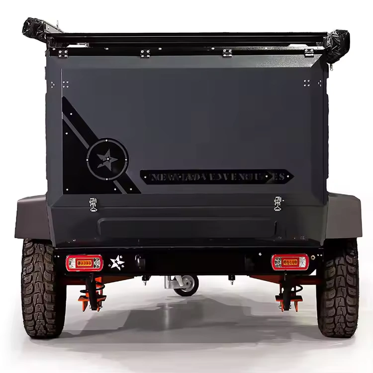 Rear view of the Swiss Army Andy off-road camper trailer showing its durable aluminum exterior and rugged tires.