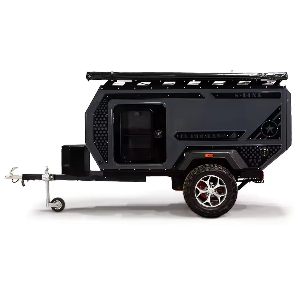 Side view of the Swiss Army Andy off-road camper trailer with a sleek dark aluminum body and robust terrain tires.