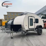 WECARE offroad teardrop caravan trailer with heavy-duty chassis and solar panels for off-grid camping adventures.