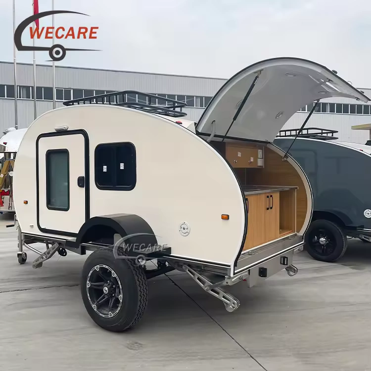 WECARE Off-Road Teardrop Caravan featuring a slide-out kitchen, rugged chassis, and solar power for off-grid adventure.