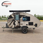 WECARE off-road teardrop caravan with ensuite and rooftop awning parked outside for your next off-grid adventure.
