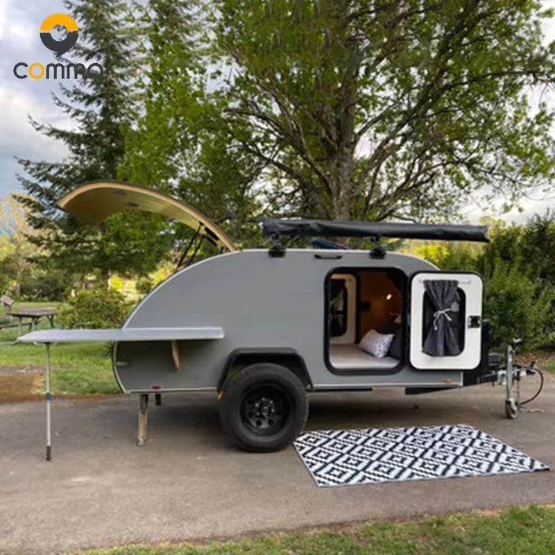 The Cody Compact mini caravan features a slide-out kitchen, rooftop awning, and an insulated aluminum body for camping.