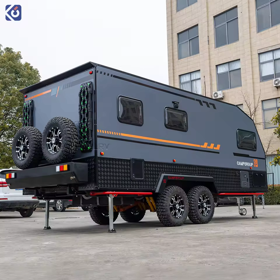 Modern TF series off-road caravan with dual axles, rugged tires, and black and grey exterior parked in an outdoor lot.